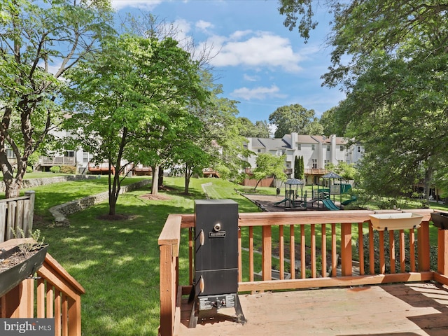 12215 Wye Oak Commons Cir Unit 66, Burke, VA 22015 - view of community featuring a playground, a lawn, a wooden deck, and a residential view
