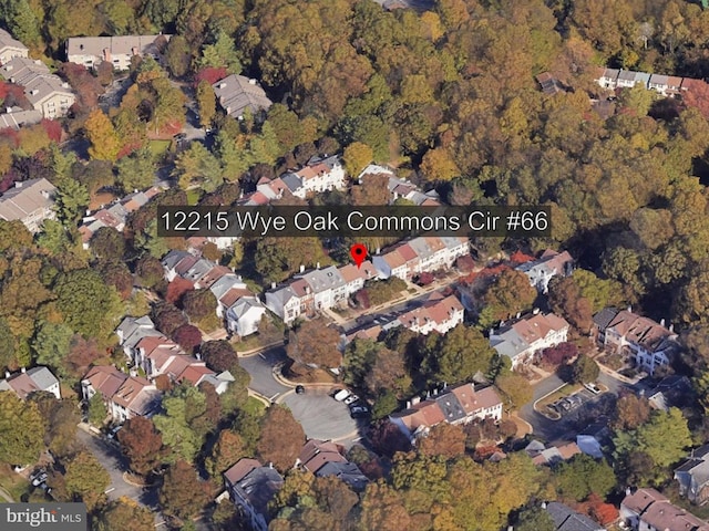 12215 Wye Oak Commons Cir Unit 66, Burke, VA 22015 - aerial view of property's location with nearby suburban area and a heavily wooded area