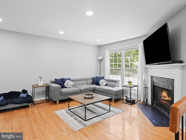 12215 Wye Oak Commons Cir Unit 66, Burke, VA 22015 - living room with a lit fireplace, wood-type flooring, and recessed lighting