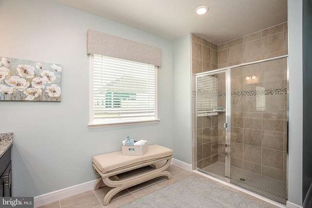 5 Williamson Rd, Winchester, VA 22602 - full bathroom featuring a stall shower, tile patterned floors, vanity, baseboards, and a textured ceiling