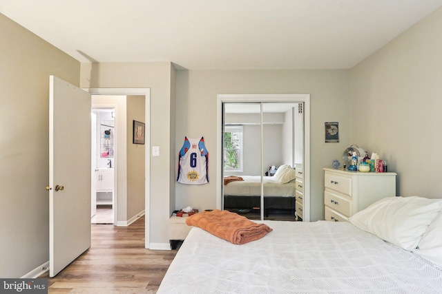 3814 Lyndhurst Dr Unit 203, Fairfax, VA 22031 - bedroom with wood finished floors, a closet, and baseboards