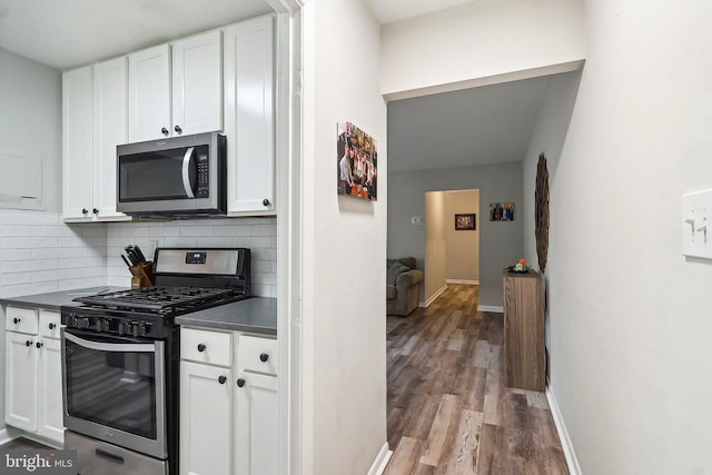 3814 Lyndhurst Dr Unit 203, Fairfax, VA 22031 - kitchen with stainless steel appliances, dark countertops, wood finished floors, and white cabinets