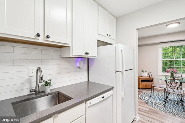 3814 Lyndhurst Dr Unit 203, Fairfax, VA 22031 - kitchen with white appliances, a sink, white cabinetry, light wood-style flooring, and dark stone countertops
