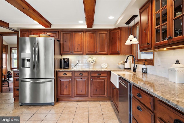 8807 Woodland Ferry Rd, Laurel, DE 19956 - kitchen featuring appliances with stainless steel finishes, a sink, beam ceiling, backsplash, and light tile patterned floors