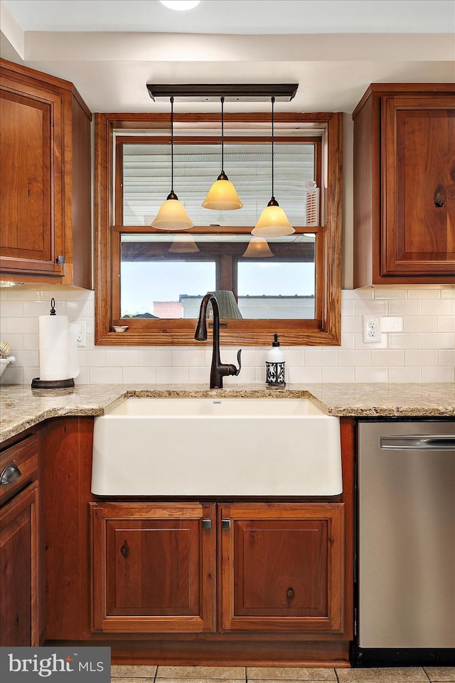 8807 Woodland Ferry Rd, Laurel, DE 19956 - kitchen featuring stainless steel dishwasher, a sink, backsplash, and light stone counters