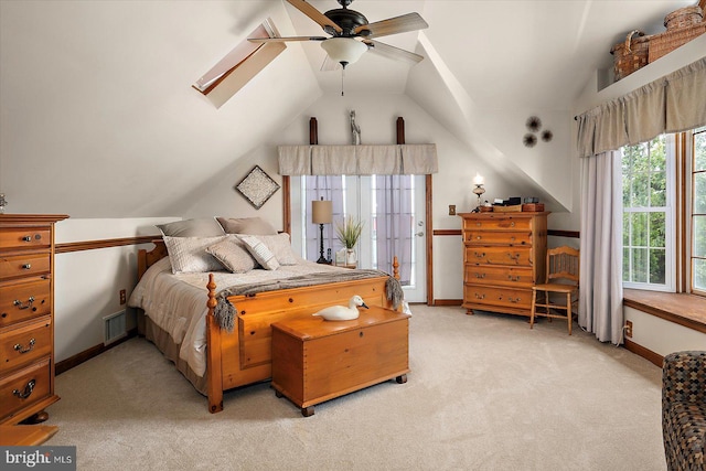 8807 Woodland Ferry Rd, Laurel, DE 19956 - bedroom with light carpet, lofted ceiling, baseboards, a skylight, and ceiling fan