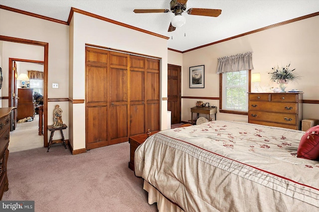 8807 Woodland Ferry Rd, Laurel, DE 19956 - bedroom featuring light carpet, a closet, crown molding, ceiling fan, and baseboards