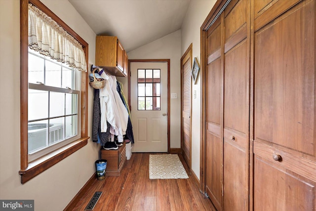 8807 Woodland Ferry Rd, Laurel, DE 19956 - entryway with vaulted ceiling, baseboards, and dark wood-type flooring