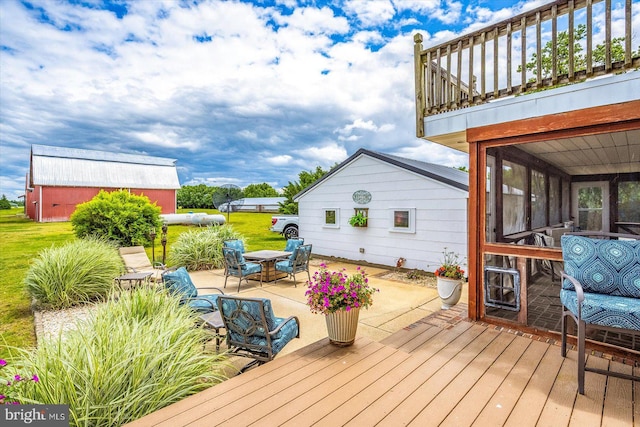 8807 Woodland Ferry Rd, Laurel, DE 19956 - wooden terrace featuring a patio and a lawn
