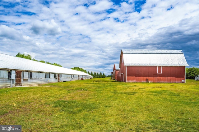 8807 Woodland Ferry Rd, Laurel, DE 19956 - view of green lawn featuring an outdoor structure and a barn