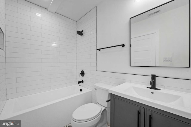 1368 Bryant St NE Unit 4, Washington, DC 20018 - bathroom featuring toilet, vanity, washtub / shower combination, and tile walls