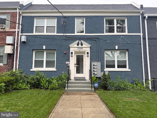 1368 Bryant St NE Unit 4, Washington, DC 20018 - view of property with brick siding and a front lawn