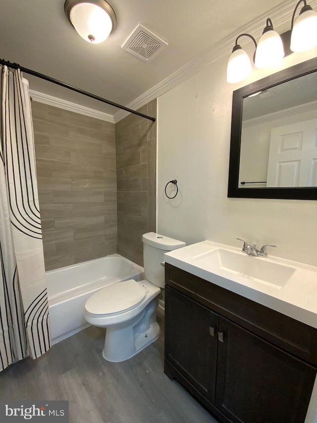 508 Boysenberry Ln, Frederick, MD 21703 - bathroom featuring wood finished floors, toilet, vanity, crown molding, and shower / bath combination with curtain