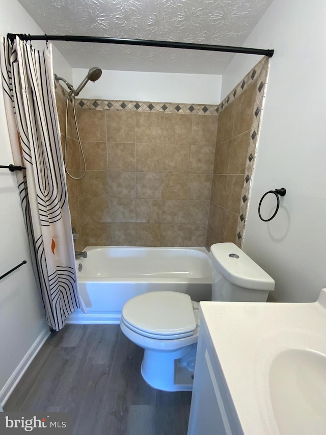 508 Boysenberry Ln, Frederick, MD 21703 - full bath featuring toilet, wood finished floors, vanity, shower / bathtub combination with curtain, and a textured ceiling