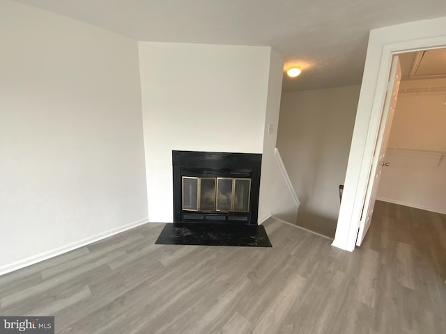 508 Boysenberry Ln, Frederick, MD 21703 - detailed view of wood finished floors, baseboards, and a fireplace with flush hearth