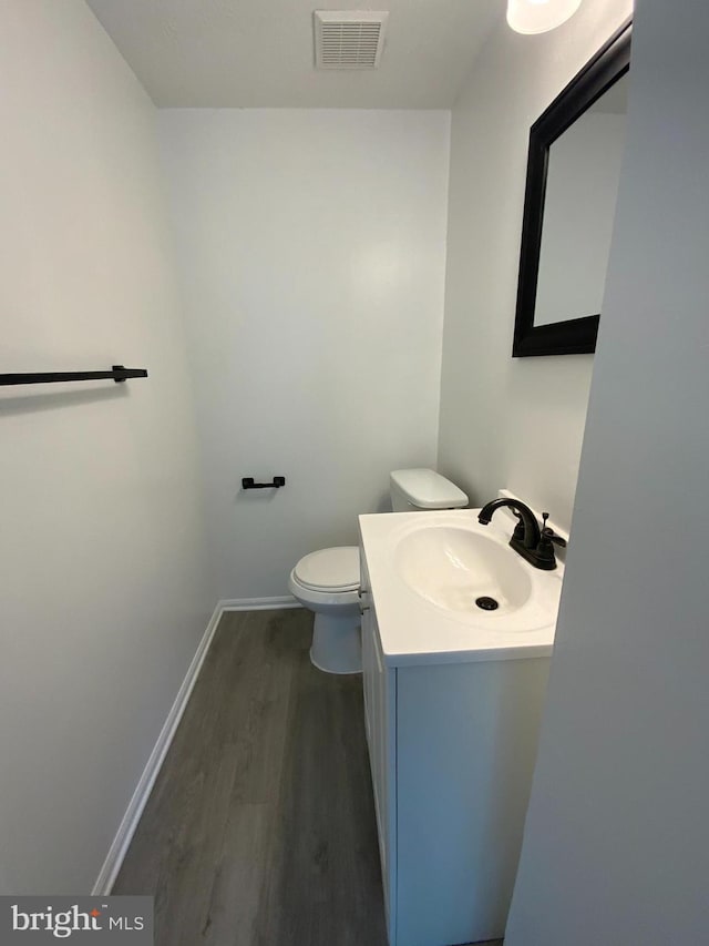 508 Boysenberry Ln, Frederick, MD 21703 - half bath featuring wood finished floors, vanity, toilet, and baseboards