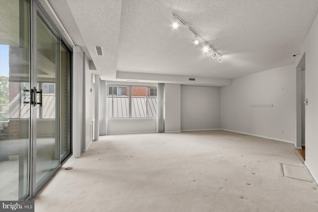 5802 Nicholson Ln Unit 2-407, Rockville, MD 20852 - spare room featuring a textured ceiling and light carpet