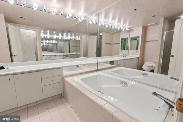 5802 Nicholson Ln Unit 2-407, Rockville, MD 20852 - full bath featuring double vanity, tile patterned flooring, a shower stall, a garden tub, and toilet