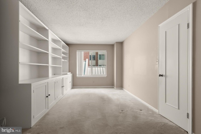 5802 Nicholson Ln Unit 2-407, Rockville, MD 20852 - empty room featuring a textured ceiling, light colored carpet, and baseboards