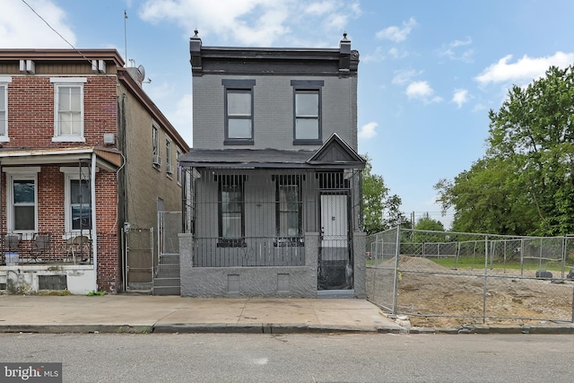 1314 Atlantic Ave, Camden, NJ 08104 - multi unit property featuring a porch, a gate, and brick siding