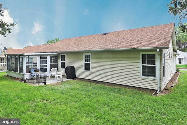 2028 Brookdale Dr, Forked River, NJ 08731 - back of property featuring a patio, a yard, a sunroom, and a shingled roof