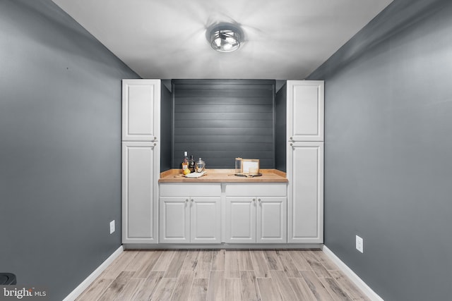 815 Summersweet Ct, Huntingtown, MD 20639 - indoor dry bar with baseboards and light wood finished floors