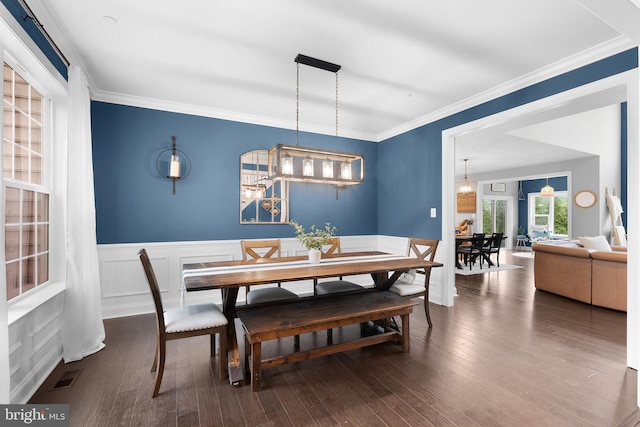 815 Summersweet Ct, Huntingtown, MD 20639 - dining room featuring wainscoting, crown molding, wood finished floors, and a chandelier