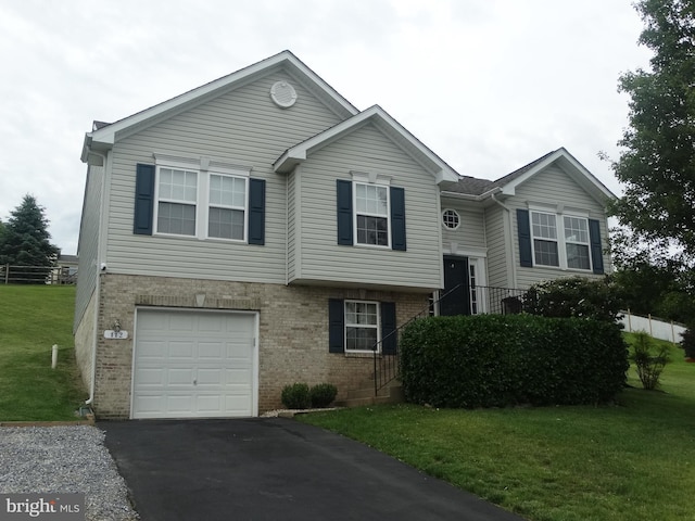 112 Colton Ct, Smithsburg, MD 21783 - bi-level home featuring brick siding, a front lawn, an attached garage, and driveway