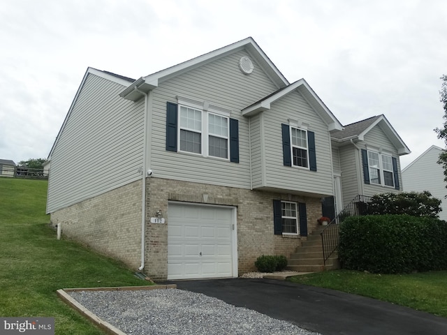 112 Colton Ct, Smithsburg, MD 21783 - view of front facade with brick siding, an attached garage, a front lawn, and driveway