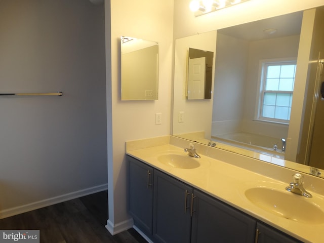 112 Colton Ct, Smithsburg, MD 21783 - full bath with double vanity, wood finished floors, a bath, and baseboards