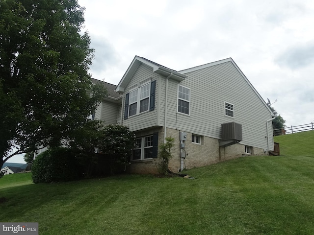 112 Colton Ct, Smithsburg, MD 21783 - view of home's exterior with a lawn, brick siding, and central air condition unit