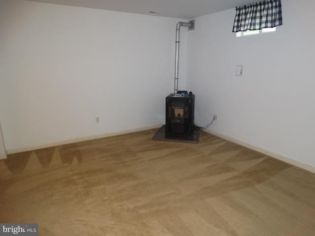 112 Colton Ct, Smithsburg, MD 21783 - basement featuring carpet flooring, a wood stove, and baseboards