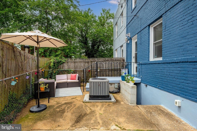 1005 Madison Ct, Annapolis, MD 21403 - fenced backyard with central AC unit, an outdoor living space, and a patio