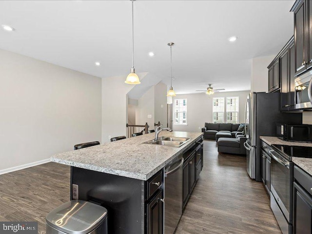 107 Lookout Way, Fredericksburg, VA 22405 - kitchen with stainless steel appliances, open floor plan, a sink, dark wood finished floors, and recessed lighting