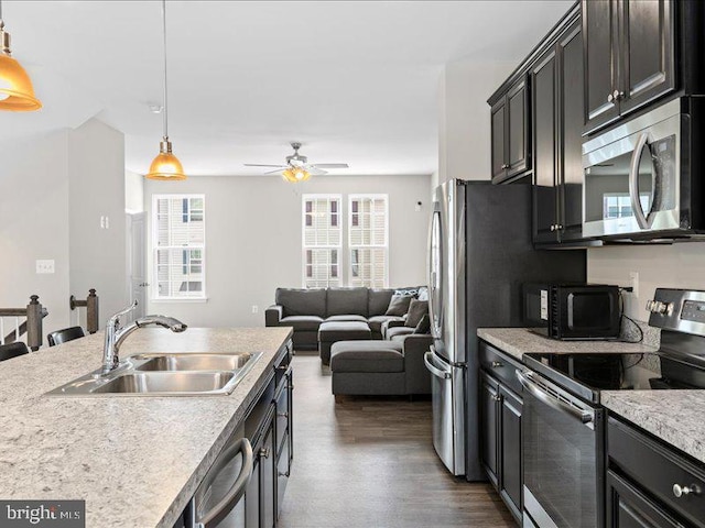 107 Lookout Way, Fredericksburg, VA 22405 - kitchen with stainless steel appliances, a sink, light countertops, and plenty of natural light