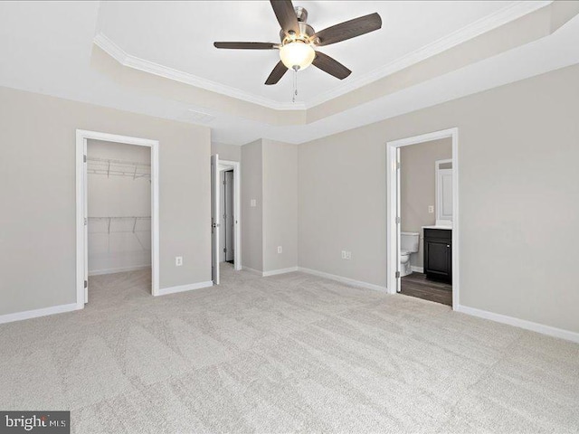 107 Lookout Way, Fredericksburg, VA 22405 - unfurnished bedroom featuring a raised ceiling, crown molding, carpet, a spacious closet, and baseboards