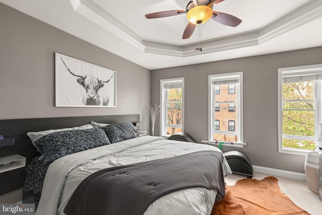 3234 Odonnell St, Baltimore, MD 21224 - carpeted bedroom featuring a tray ceiling, baseboards, ceiling fan, and crown molding