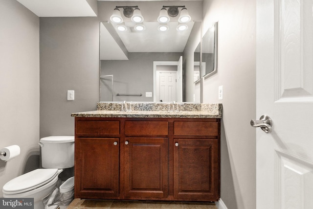 3234 Odonnell St, Baltimore, MD 21224 - full bath with double vanity, toilet, and baseboards
