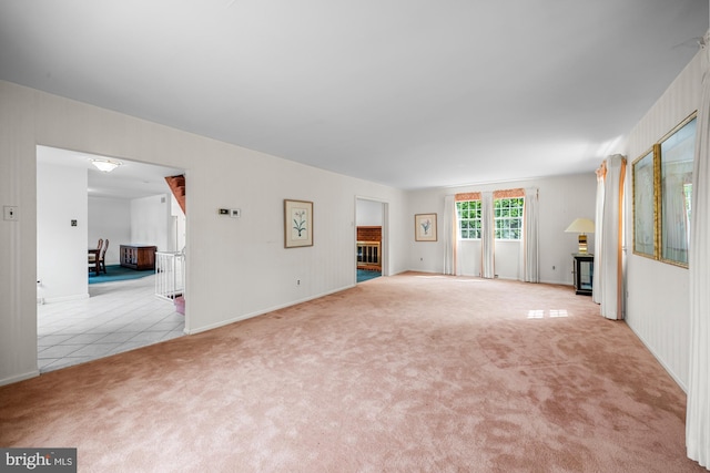 1 Carriage Way, Cinnaminson, NJ 08077 - unfurnished living room with carpet floors, tile patterned flooring, and baseboards
