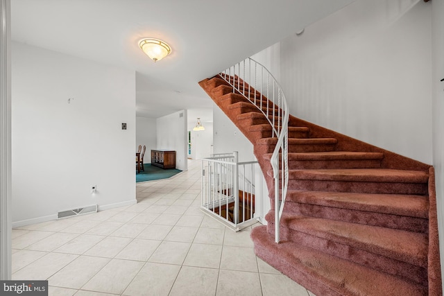 1 Carriage Way, Cinnaminson, NJ 08077 - stairway featuring tile patterned flooring and baseboards
