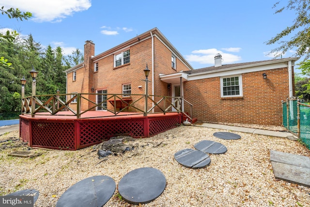 1 Carriage Way, Cinnaminson, NJ 08077 - back of house with a chimney, brick siding, and a deck