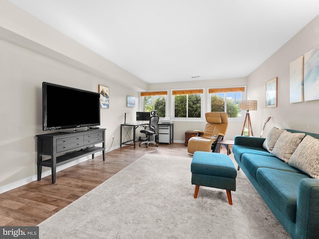 11 E Avon Dr Unit E, Hightstown, NJ 08520 - living area featuring a desk, wood finished floors, and baseboards
