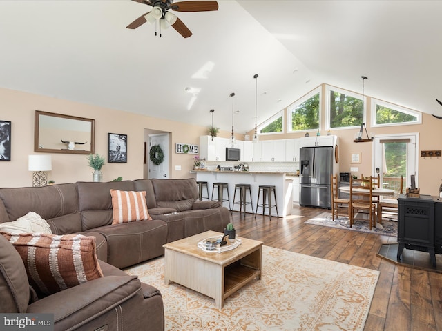 1439 Fiery Run Rd, Linden, VA 22642 - living room with a ceiling fan, high vaulted ceiling, hardwood / wood-style floors, plenty of natural light, and a wood stove