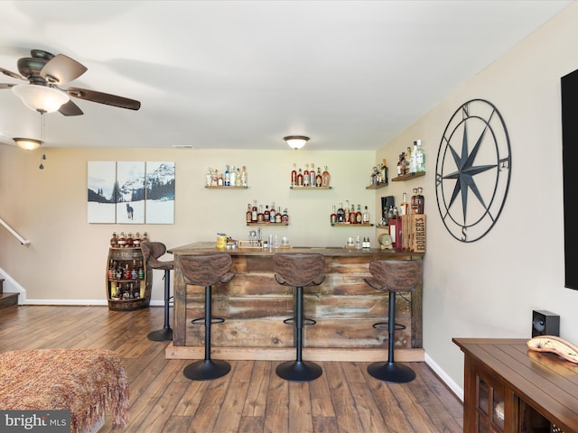 1439 Fiery Run Rd, Linden, VA 22642 - indoor bar featuring dark wood-style floors, a ceiling fan, stairs, and baseboards