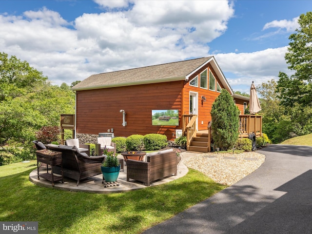 1439 Fiery Run Rd, Linden, VA 22642 - view of front facade featuring a deck, an outdoor hangout area, a front yard, a shingled roof, and a patio area