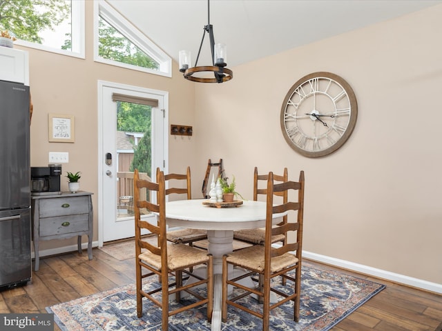 1439 Fiery Run Rd, Linden, VA 22642 - dining room with wood-type flooring, a chandelier, baseboards, and high vaulted ceiling