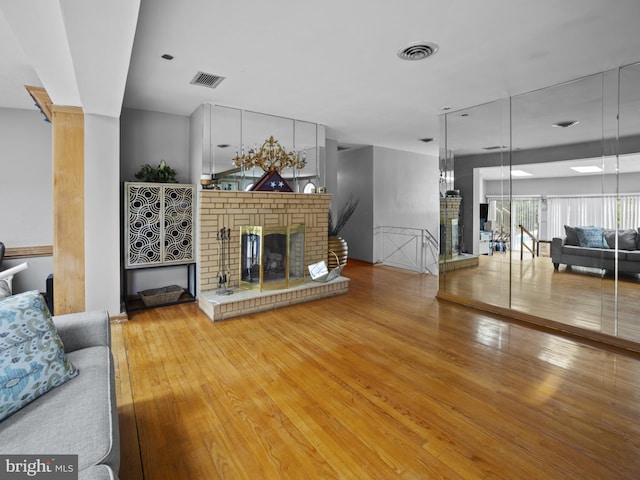 4326 Ranger Ave, Temple Hills, MD 20748 - living area featuring a brick fireplace and hardwood / wood-style floors