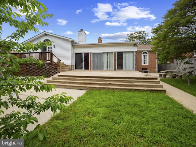 4326 Ranger Ave, Temple Hills, MD 20748 - back of property featuring a deck, a lawn, a chimney, and brick siding
