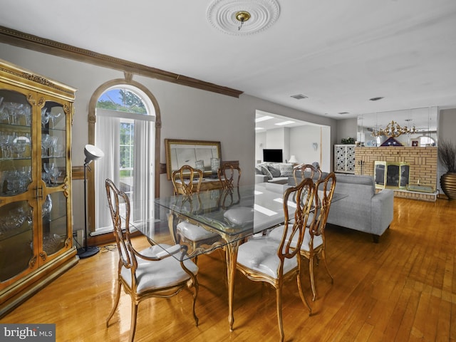 4326 Ranger Ave, Temple Hills, MD 20748 - dining room with a brick fireplace and hardwood / wood-style flooring