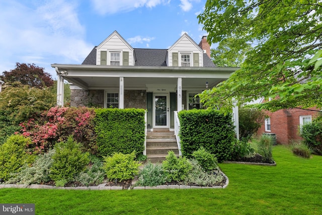 915 Edgewood Dr, Springfield, PA 19064 - view of front of property featuring a chimney, a front yard, stone siding, and a porch